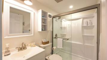 Shower, hair dryer, towels, soap