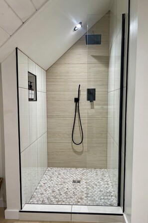 Shower, hair dryer, towels, soap