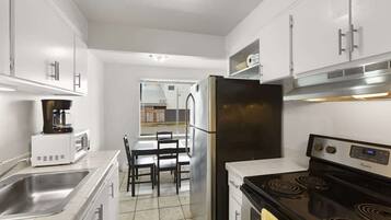 Fridge, microwave, oven, cookware/dishes/utensils