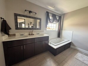 Jetted tub, hair dryer, towels, soap