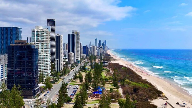 A coastal cityscape with high-rise buildings, a beach, and a clear sky. - Broadbeach | 2Min to Beach | Pool | Free Parking (Broadbeach)