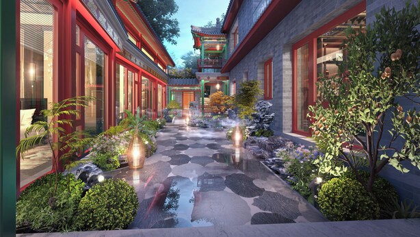 A courtyard with traditional architecture, stone pathways, and illuminated lanterns.