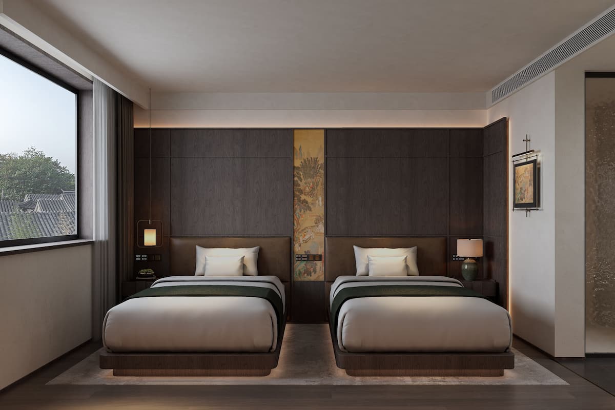 A modern hotel room with two beds, a large window, and a cityscape view.