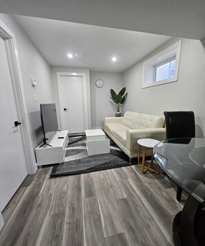 Living area - Bright & Modern Basement Suite in Regina (Regina)