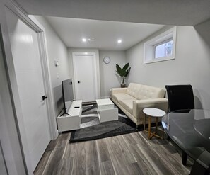 Living area - Bright & Modern Basement Suite in Regina (Regina)