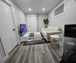 Living area - Bright & Modern Basement Suite in Regina (Regina)