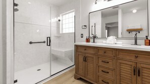 Shower, hair dryer, towels, shampoo