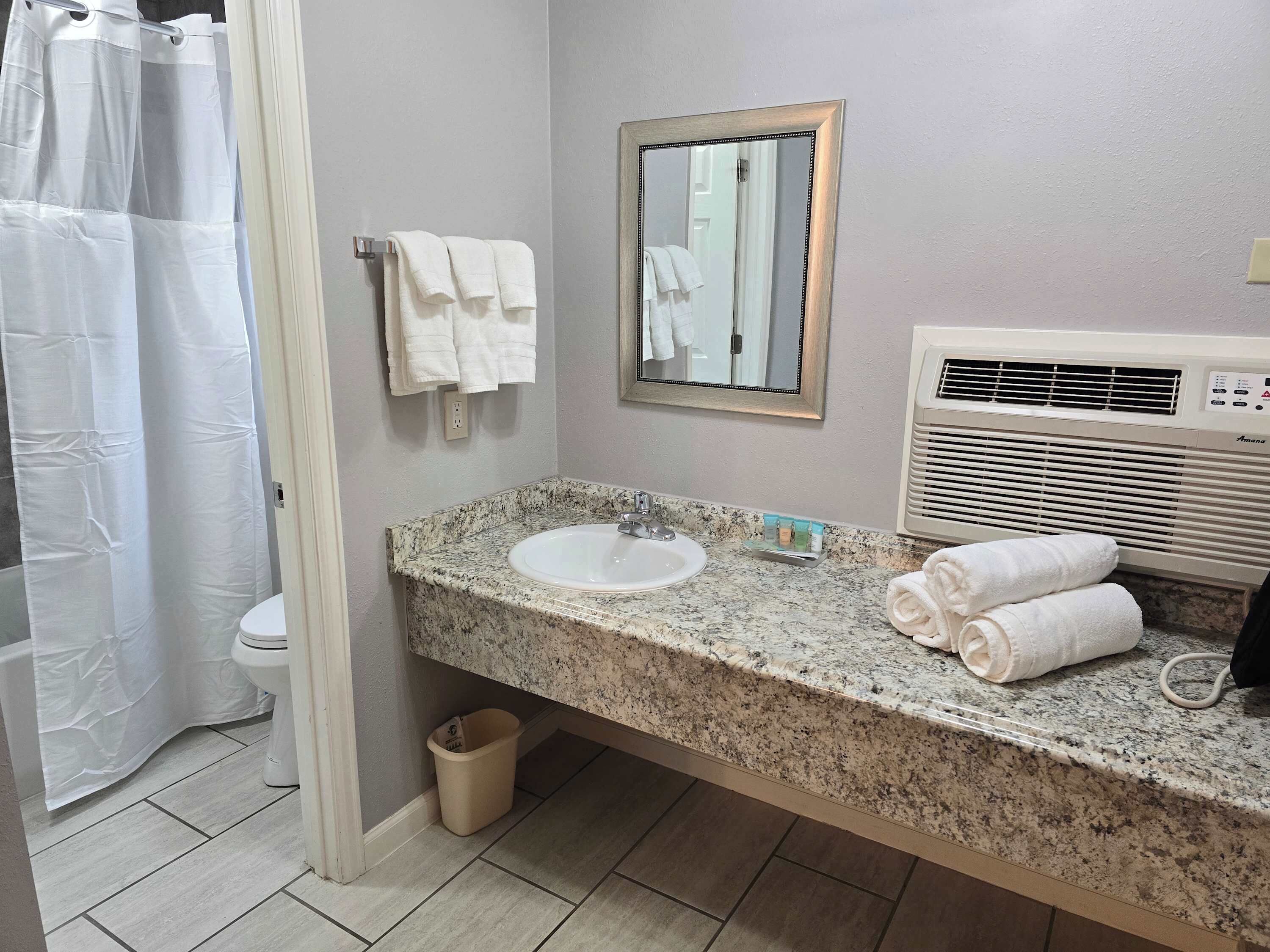 Shower, hair dryer, towels, shampoo