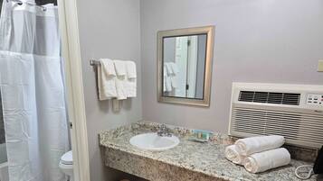Shower, hair dryer, towels, shampoo