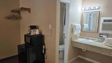Shower, hair dryer, towels, shampoo