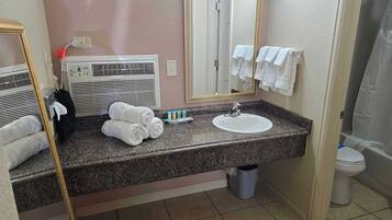 Shower, hair dryer, towels, shampoo