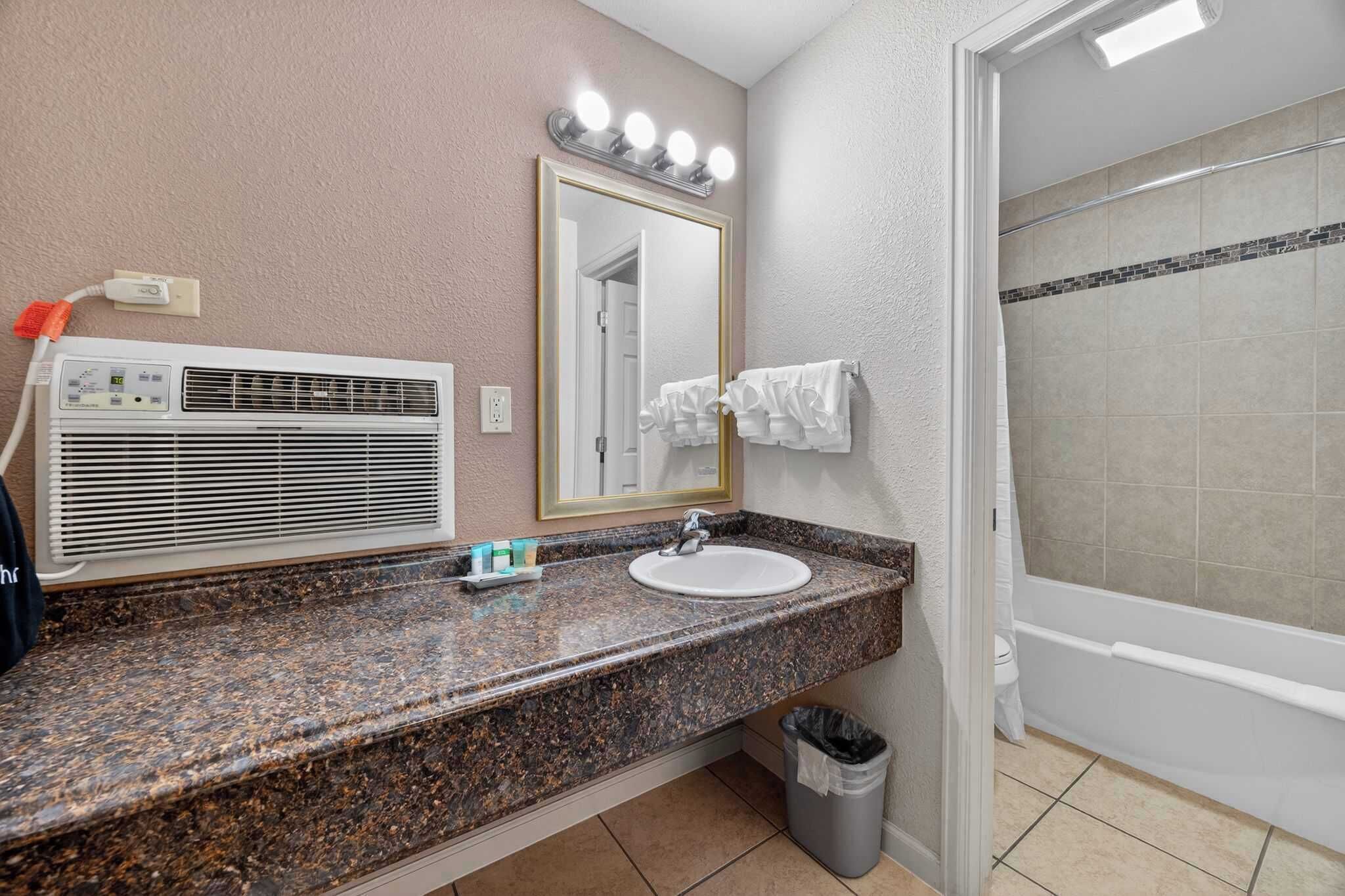 Shower, hair dryer, towels, shampoo