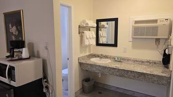 Shower, hair dryer, towels, shampoo