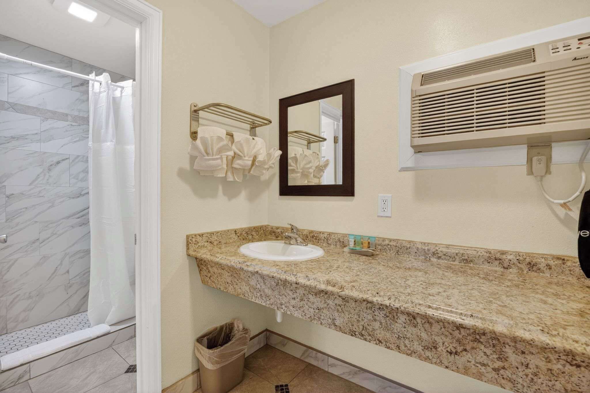 Shower, hair dryer, towels, shampoo