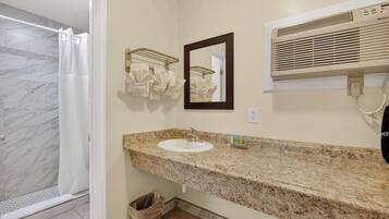 Shower, hair dryer, towels, shampoo