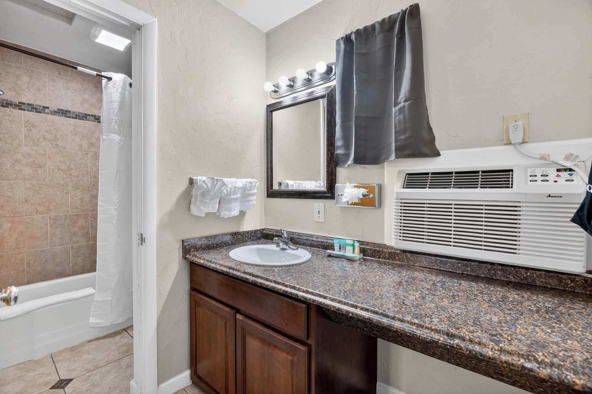 Shower, hair dryer, towels, shampoo