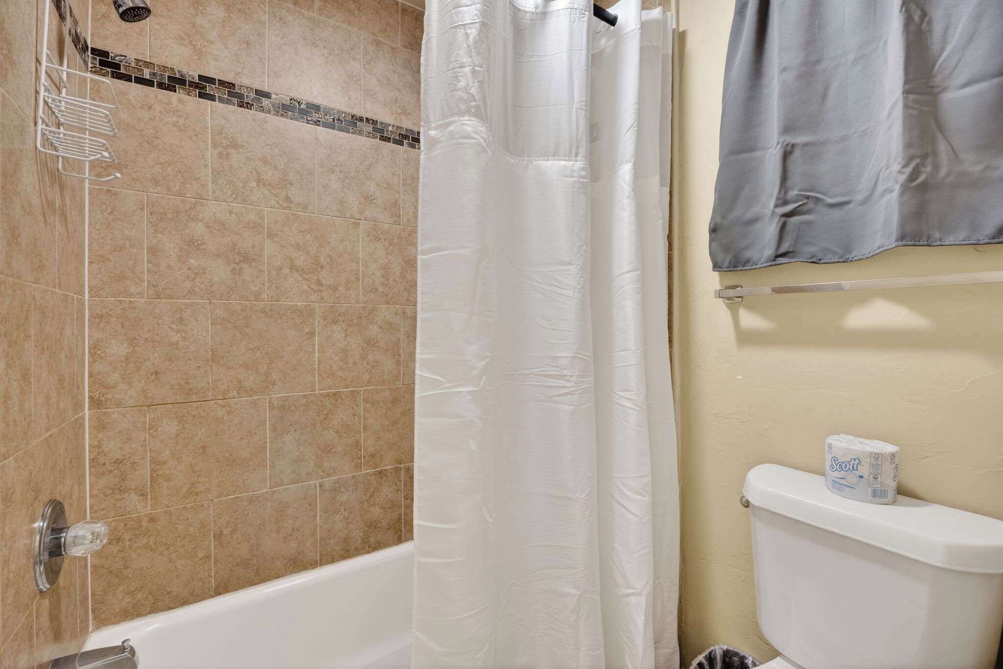 Shower, hair dryer, towels, shampoo