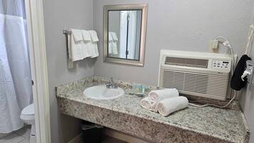 Shower, hair dryer, towels, shampoo