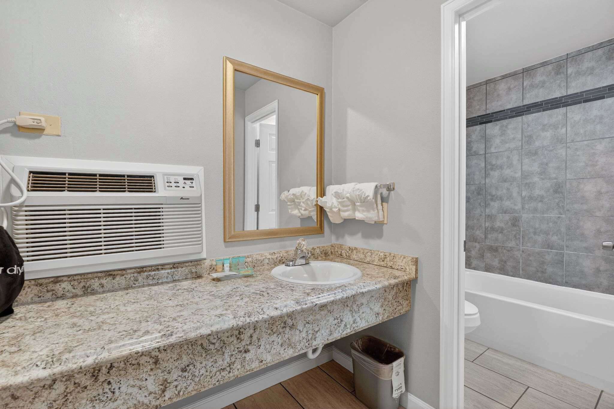 Shower, hair dryer, towels, shampoo
