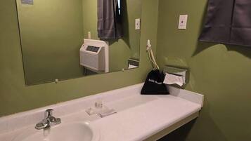 Shower, hair dryer, towels, shampoo