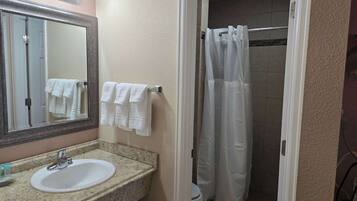 Shower, hair dryer, towels, shampoo