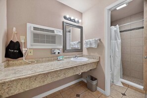 Shower, hair dryer, towels, shampoo