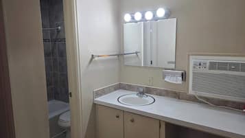 Shower, hair dryer, towels, shampoo