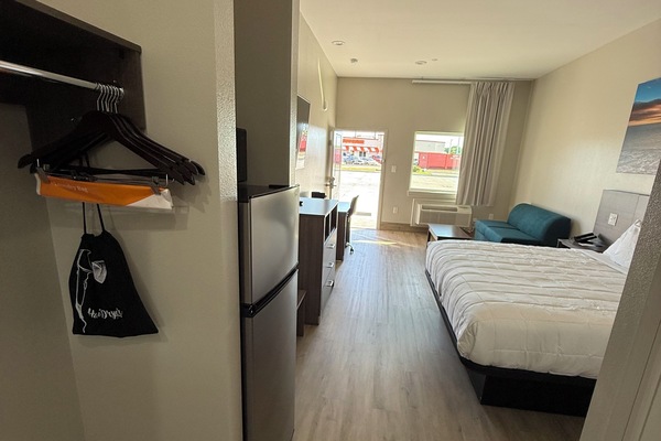 Premium bedding, laptop workspace, blackout drapes, soundproofing