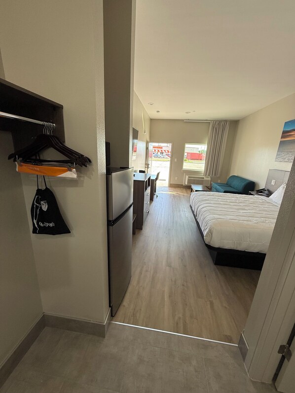 Premium bedding, laptop workspace, blackout drapes, soundproofing