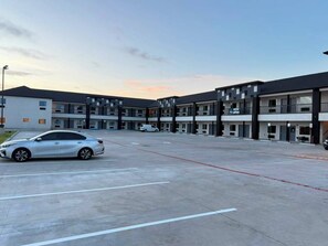 A multi-story parking structure with a white car parked in the foreground. - Clarion Pointe Port Lavaca (Port Lavaca)