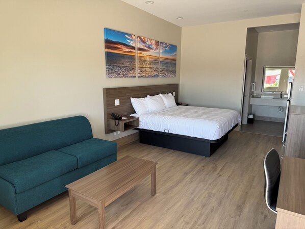 Premium bedding, laptop workspace, blackout drapes, soundproofing
