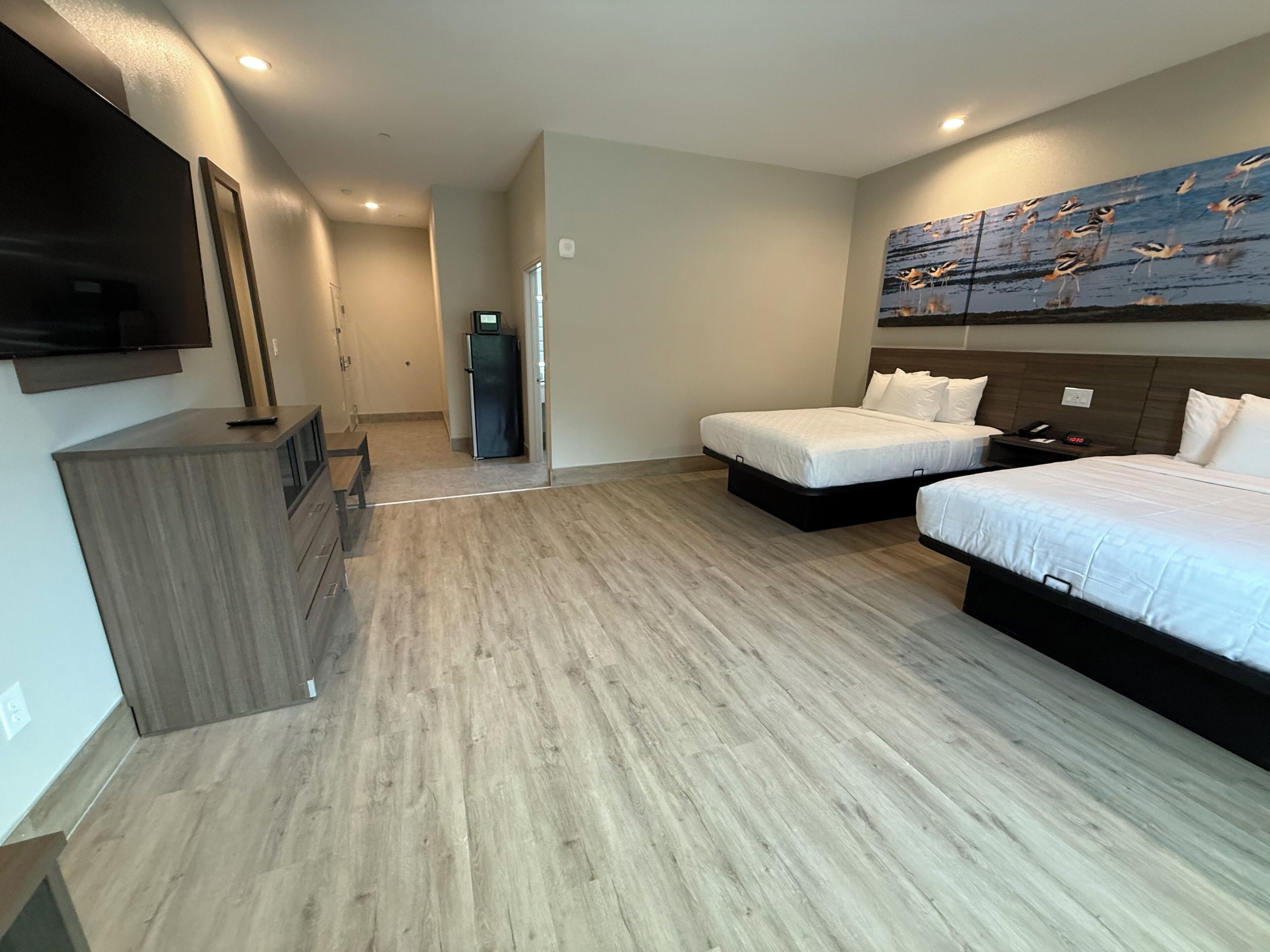Premium bedding, laptop workspace, blackout drapes, soundproofing