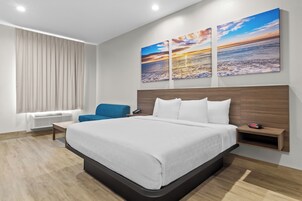 Premium bedding, laptop workspace, blackout curtains, soundproofing