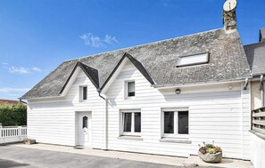A white two-story house with a gabled roof, a chimney, and a small porch area. - MAISON PROCHE DE LA MER 1 (Bricqueville sur mer)