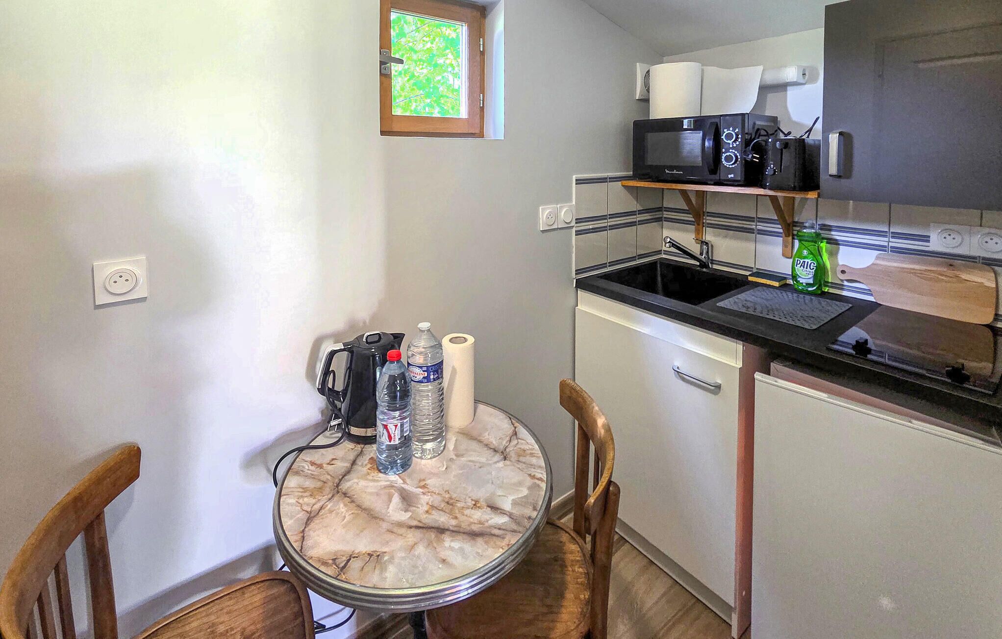 Fridge, microwave, coffee/tea maker, cookware/dishes/utensils