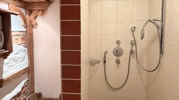 Shower, hair dryer, towels, toilet paper