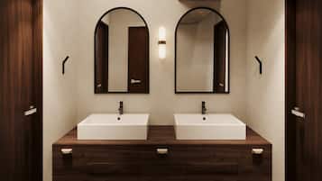Deluxe Studio | Bathroom | Shower, free toiletries, hair dryer, slippers