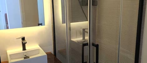 Shower, towels, soap, toilet paper