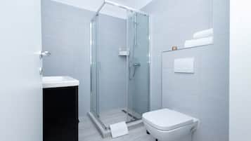 Shower, hair dryer, towels, shampoo