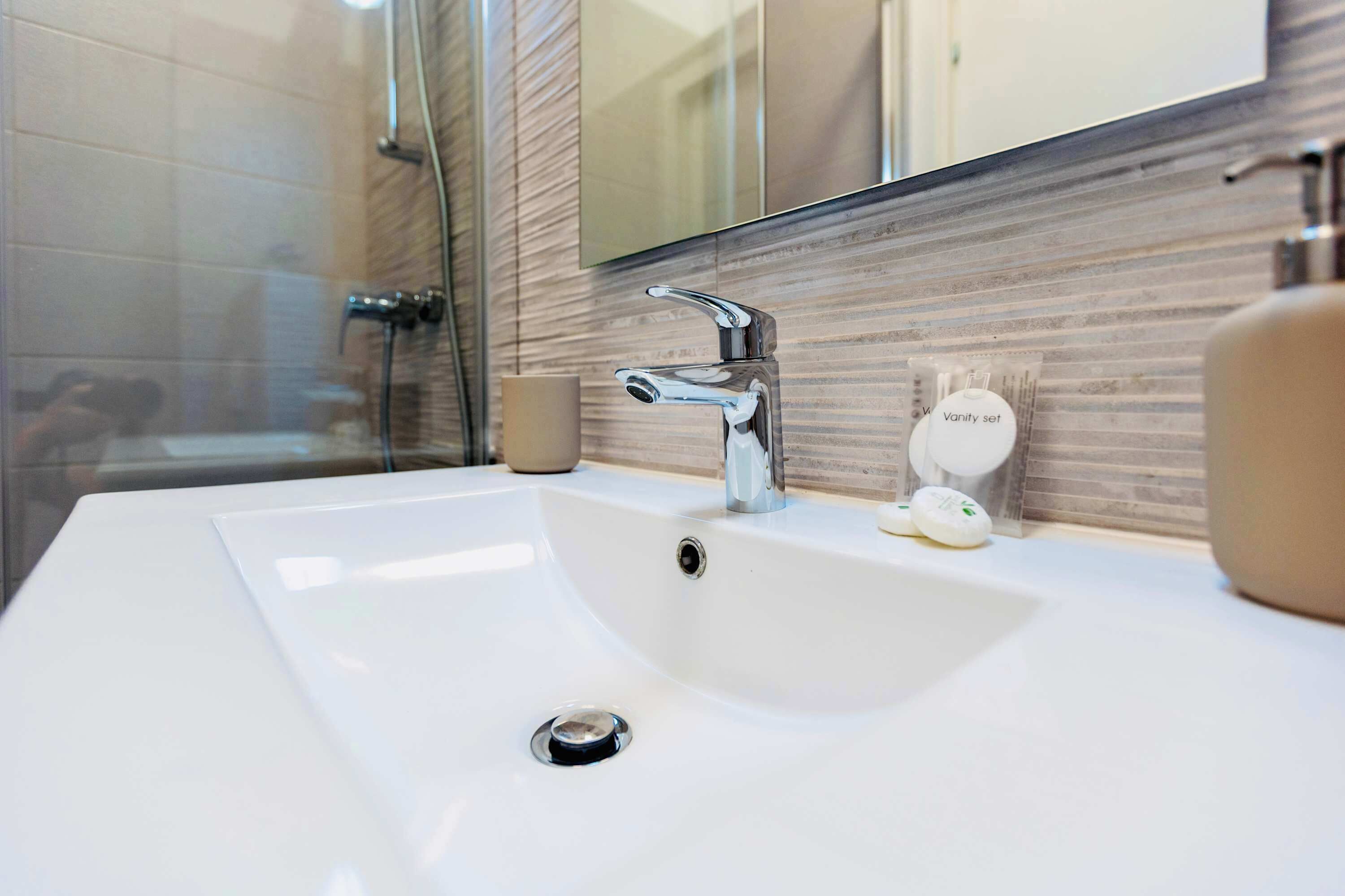Shower, hair dryer, towels, shampoo