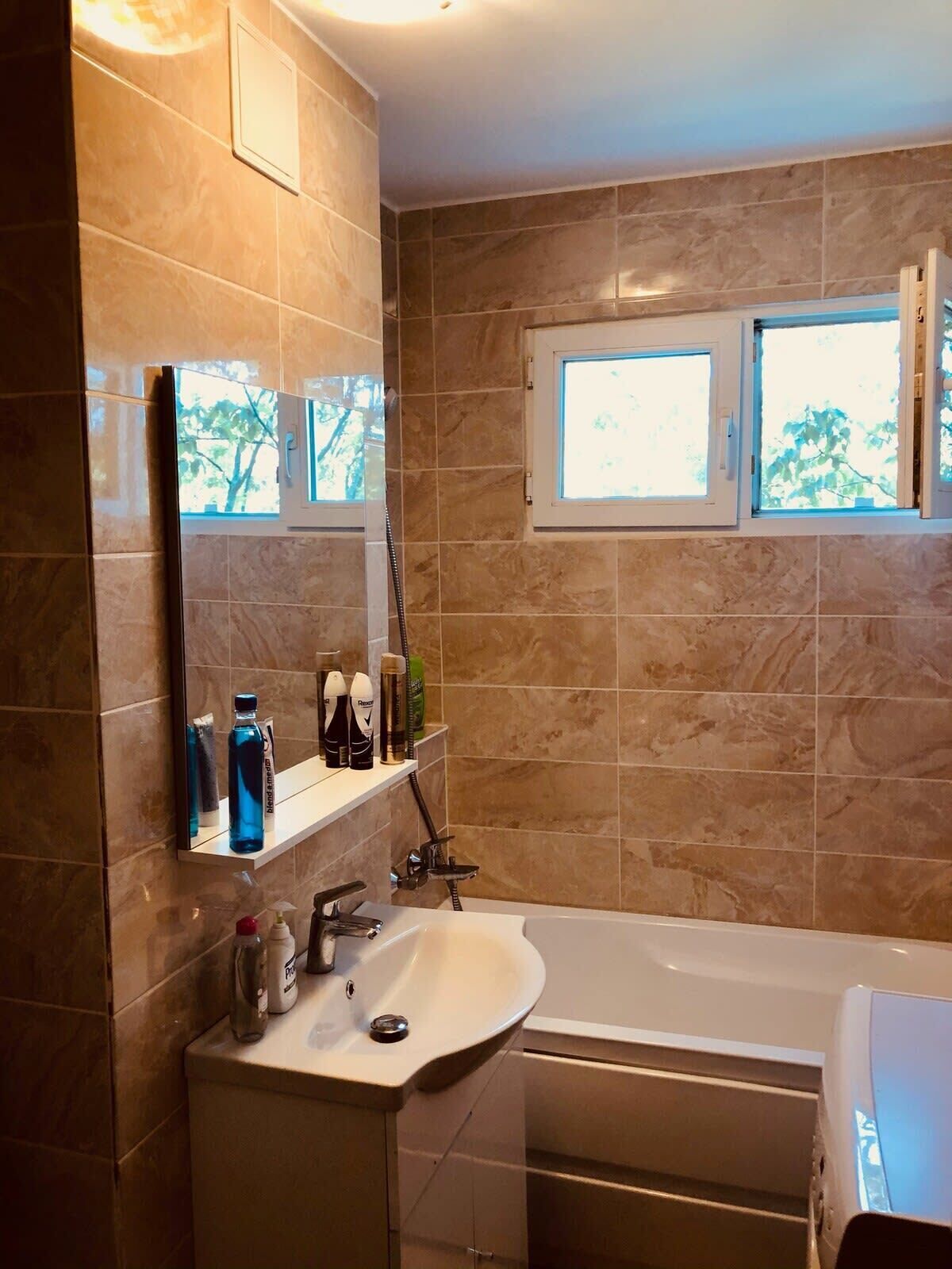 Shower, hair dryer, towels, shampoo