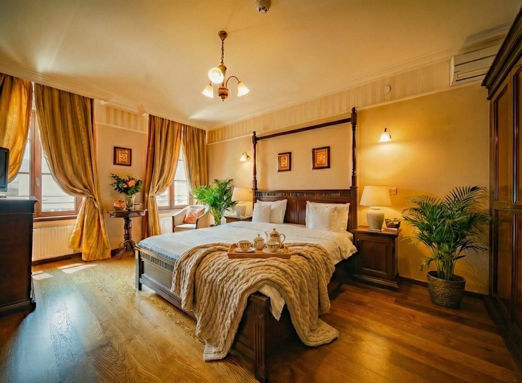 A four-poster bed with a canopy, a bedside table with a lamp, a potted plant, and a window with curtains.