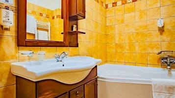 Shower, hair dryer, towels, shampoo
