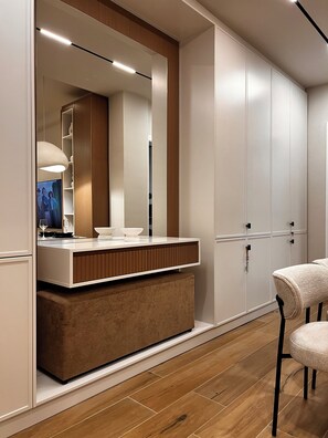 A modern bathroom with a vanity, mirror, and cabinets. - Zest Premium Apartments 4 (Durrës)