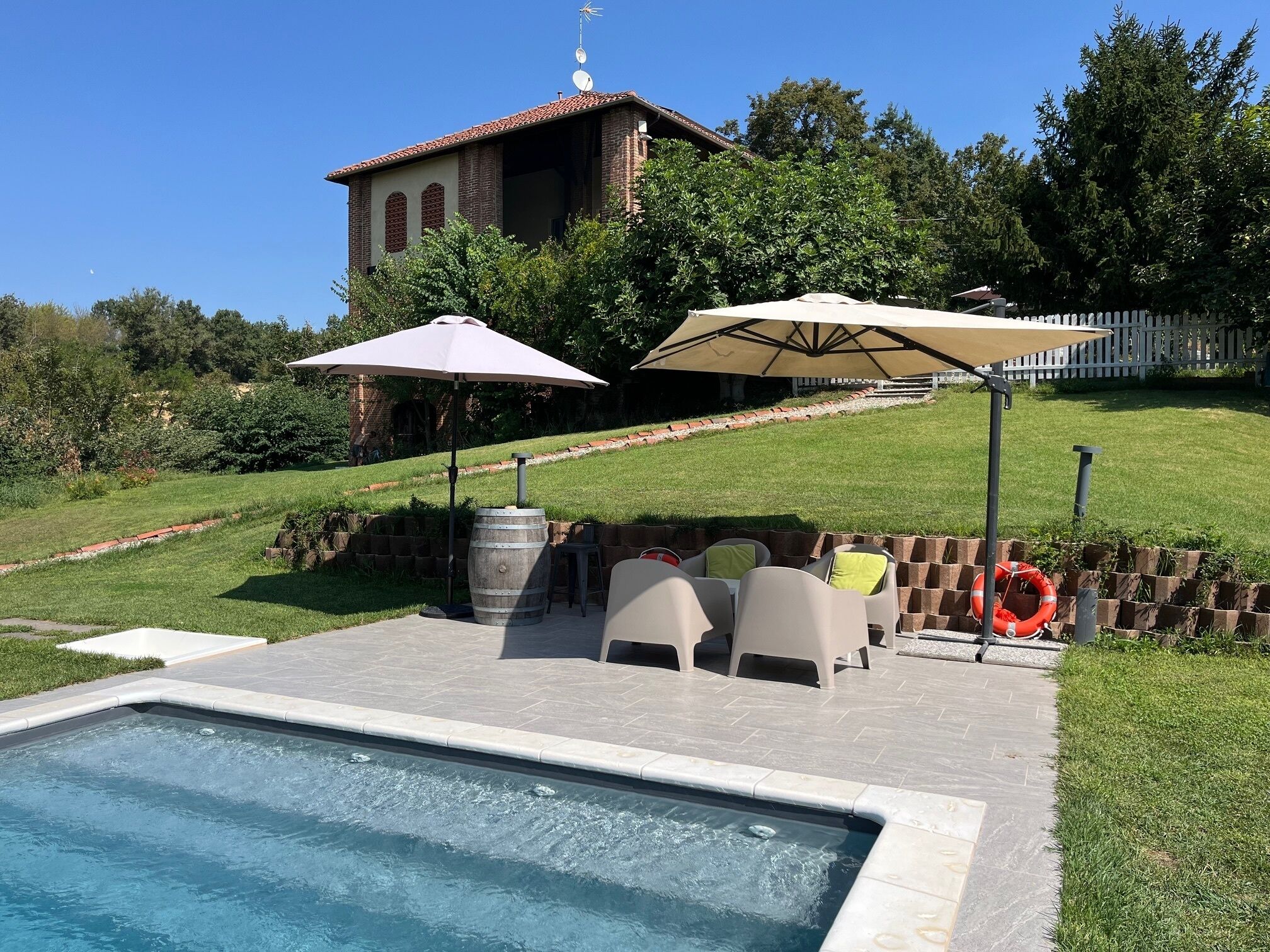 Seasonal outdoor pool, open 9:30 AM to 7:00 PM, pool umbrellas