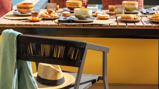 A dining table with various dishes and a view of a coastal landscape. - San Pietro Terrace by the Sea (Portovenere)