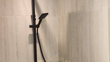 Shower, hair dryer, towels, toilet paper