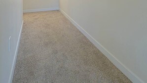 A hallway with a carpeted floor, a window with blinds, and a framed painting on the wall. - 4 Bed 3 Bath House In With Movie Theatre FREE WIFI (Gold Hill)