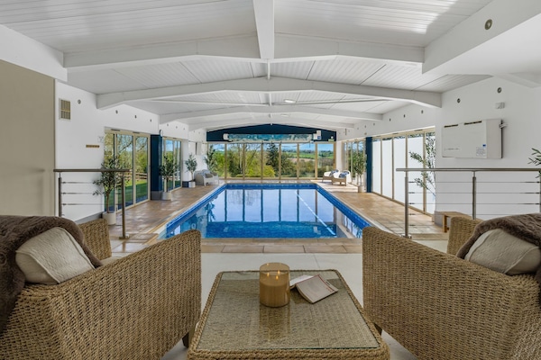 A stylish, heated indoor pool on-site