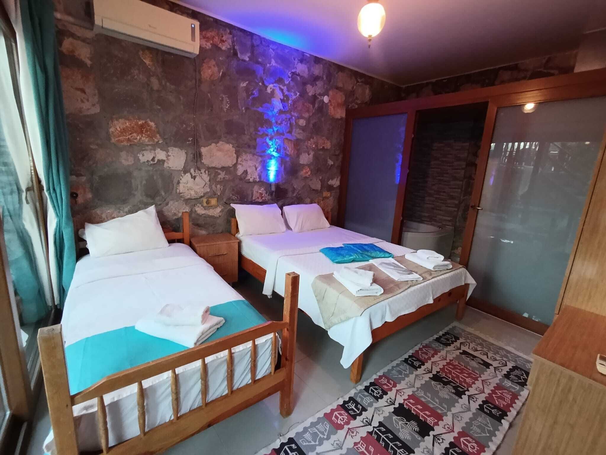 Economy Triple Room, Partial Sea View | Desk, free WiFi